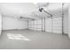Spacious three-car garage with epoxy flooring and automatic door openers at 2365 S Clayton St, Denver, CO 80210