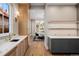 Stylish butler's pantry with custom cabinets, marble countertop, and undermount sink at 2365 S Clayton St, Denver, CO 80210