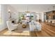 Open-concept living area showcases a fireplace and seamless transition to the outdoor spaces at 2365 S Clayton St, Denver, CO 80210
