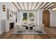 Bright living room with wood beams, fireplace and hardwood floors at 2365 S Clayton St, Denver, CO 80210
