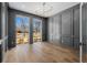Modern living room with dark gray wainscoting and large windows at 2365 S Clayton St, Denver, CO 80210