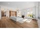 Spacious living room filled with natural light, fireplace, and seamless flow to the outdoors at 2365 S Clayton St, Denver, CO 80210