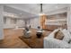 Cozy living room featuring a decorative bar, modern lighting, and neutral furnishings at 2365 S Clayton St, Denver, CO 80210