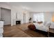 Stylish main bedroom features hardwood floors, a modern fireplace, accent rug and recessed lighting at 2365 S Clayton St, Denver, CO 80210
