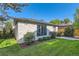 Charming stone outbuilding featuring a well-manicured lawn and landscaping at 2365 S Clayton St, Denver, CO 80210