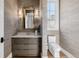 Elegant powder room with custom vanity, designer mirror, and sophisticated wallcovering at 2365 S Clayton St, Denver, CO 80210