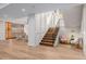 Inviting staircase leading to a bright living area with a wine bar at 2365 S Clayton St, Denver, CO 80210