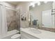 Well-lit bathroom with white vanity, shower with grab bar, and tasteful decor at 763 Sage Forest Ln, Monument, CO 80132
