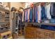 Organized walk-in closet with ample storage space for clothing, shoes, and accessories at 763 Sage Forest Ln, Monument, CO 80132