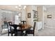 Cozy dining area features a round wood table and sliding glass doors to the outdoor area at 763 Sage Forest Ln, Monument, CO 80132