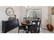 Dining room featuring a round table, four chairs, and sliding patio doors at 763 Sage Forest Ln, Monument, CO 80132