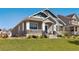 Beautiful home features a welcoming porch, well-maintained landscaping, and charming curb appeal at 763 Sage Forest Ln, Monument, CO 80132