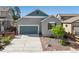 Stylish home featuring a well-maintained lawn, neutral tones, and attached two car garage at 763 Sage Forest Ln, Monument, CO 80132