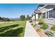 Charming home exterior with professional landscaping, manicured lawn, and scenic neighborhood views at 763 Sage Forest Ln, Monument, CO 80132