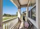 Inviting porch with relaxing bench seating and scenic neighborhood views at 763 Sage Forest Ln, Monument, CO 80132