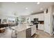 Kitchen with stainless steel appliances, counter seating, and open floor plan to living room at 763 Sage Forest Ln, Monument, CO 80132