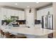 Stylish kitchen boasting white cabinetry, stainless steel appliances, and a marble island at 763 Sage Forest Ln, Monument, CO 80132