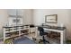 Comfortable home office features a stylish desk, storage, and natural light from the window at 763 Sage Forest Ln, Monument, CO 80132