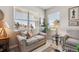 Bright sitting area featuring comfortable armchairs and inviting natural light at 763 Sage Forest Ln, Monument, CO 80132