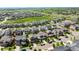 An aerial view captures a residential area with well-maintained houses, green spaces, and a community environment at 10057 Des Moines St, Parker, CO 80134