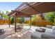 Backyard patio featuring an outdoor dining table with comfortable seating, as well as an outdoor lounge area at 10057 Des Moines St, Parker, CO 80134