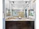 Contemporary bathroom with double vanity, granite countertops and decorative mirrors at 10057 Des Moines St, Parker, CO 80134