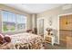 Bright bedroom featuring a large window and stylish furnishings at 10057 Des Moines St, Parker, CO 80134