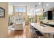 Open-concept living space with high ceilings, a kitchen island, and a view into the dining area and living room at 10057 Des Moines St, Parker, CO 80134