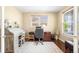 Bright home office with hardwood floors, dual windows, and plenty of space for dual desks and a comfortable workspace at 10057 Des Moines St, Parker, CO 80134