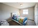 This carpeted bedroom has a light and bright feel with a window and white trim at 11677 Park South Ln, Parker, CO 80138