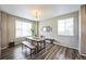 Dining area featuring a modern chandelier and windows providing natural light at 11677 Park South Ln, Parker, CO 80138