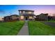 Beautiful two-story home with a well-maintained lawn and inviting front porch at 11677 Park South Ln, Parker, CO 80138