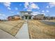Inviting home with an American flag, featuring a walkway to the charming front porch at 11677 Park South Ln, Parker, CO 80138