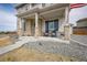 Close-up of the front porch showcasing stone accents and comfortable seating at 11677 Park South Ln, Parker, CO 80138