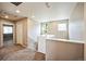 Upstairs landing with carpet, bright paint, and two windows at the top of the stairs at 11677 Park South Ln, Parker, CO 80138
