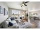 Comfortable living room featuring a neutral color palette, hardwood floors, and ample natural light at 11677 Park South Ln, Parker, CO 80138