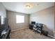 This well-lit office features neutral walls and carpet, desk, and a window providing natural light at 11677 Park South Ln, Parker, CO 80138