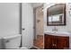 Bright bathroom with updated vanity and walk in closet access at 200 N Sherman St # 7, Denver, CO 80203