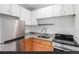 Efficient kitchen layout with stainless steel appliances and granite counters at 200 N Sherman St # 7, Denver, CO 80203
