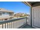 Balcony view of the neighborhood, showcasing buildings and the clear sky at 9351 Amison Cir # 104, Parker, CO 80134