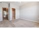 Bedroom showcasing plush carpet and entry to another room with shower at 9351 Amison Cir # 104, Parker, CO 80134