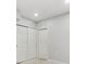 Neutral bedroom featuring sliding door closet and an entrance to another room at 9351 Amison Cir # 104, Parker, CO 80134