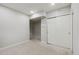 Neutral bedroom featuring sliding door closet and an entrance to another room at 9351 Amison Cir # 104, Parker, CO 80134