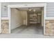 Unit 104 garage featuring shelving, storage and bright lighting at 9351 Amison Cir # 104, Parker, CO 80134