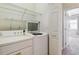 Laundry room featuring washer, dryer, wire shelves, and access to bedroom at 9351 Amison Cir # 104, Parker, CO 80134