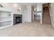 Spacious living room with fireplace, adjacent to staircase and kitchen at 9351 Amison Cir # 104, Parker, CO 80134