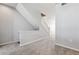 Carpeted staircase featuring neutral walls, carpeted stairs, and white trim at 9351 Amison Cir # 104, Parker, CO 80134