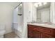 Bathroom featuring a vanity with modern sink and a shower/tub combo at 804 Summer Hawk Dr # 303, Longmont, CO 80504