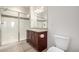 Well-lit bathroom features a glass-door shower and a modern vanity at 804 Summer Hawk Dr # 303, Longmont, CO 80504