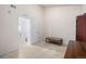 Well lit bedroom with a bench and open door looking into another room at 804 Summer Hawk Dr # 303, Longmont, CO 80504